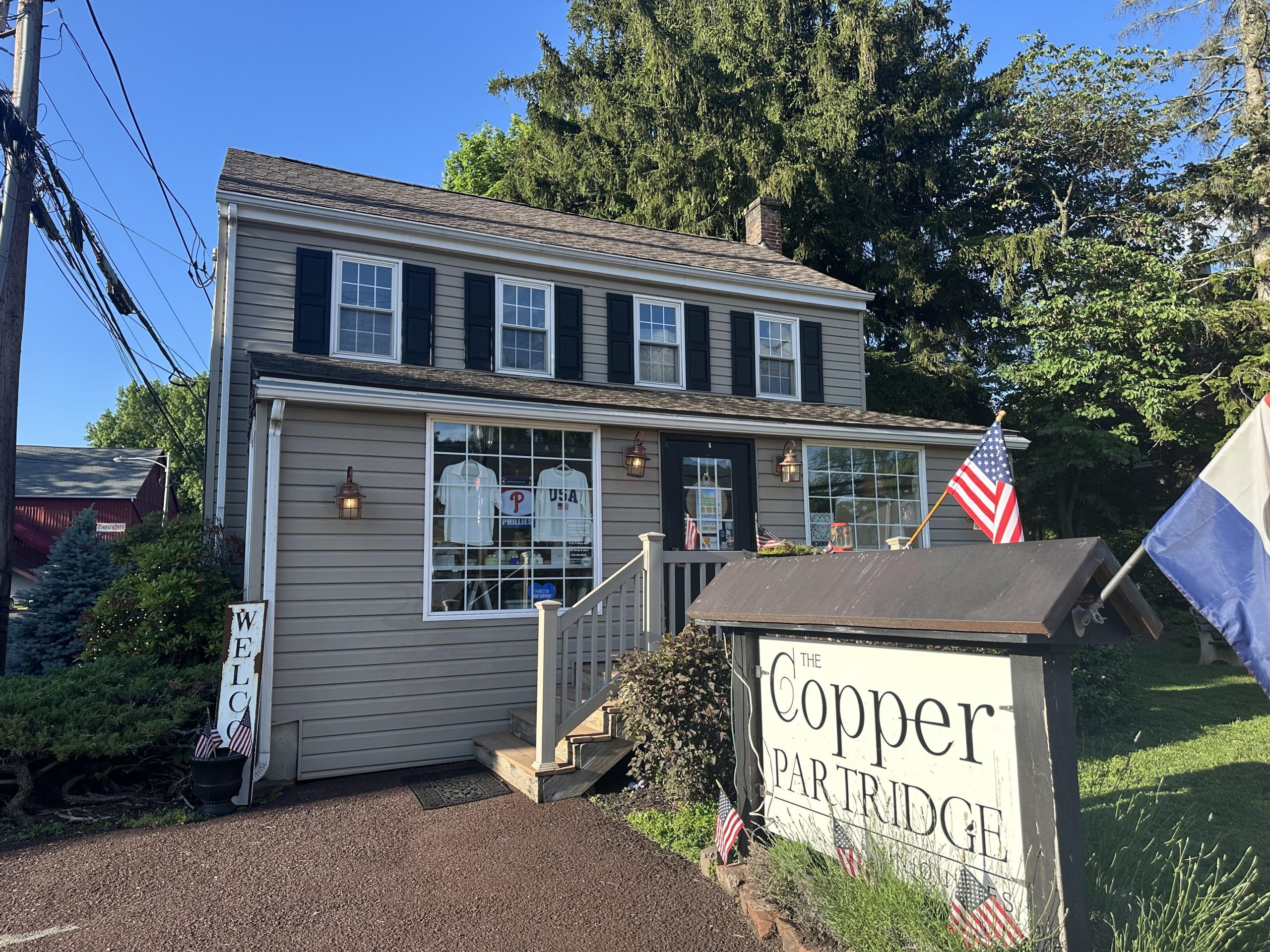 The Copper Partridge storefront during summer